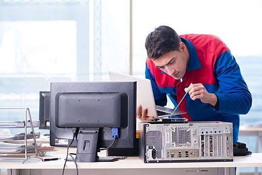 Technician Repairing Desktop
